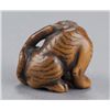 Image 4 : A wood netsuke of a tigress and cub.