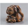 Image 6 : A wood netsuke of a tigress and cub.