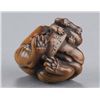 Image 7 : A wood netsuke of a tigress and cub.