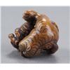 Image 9 : A wood netsuke of a tigress and cub.