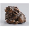 Image 1 : A wood netsuke of a goat.
