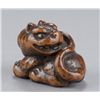 Image 1 : A wood netsuke of a tiger.