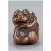 Image 5 : A wood netsuke of a tiger.