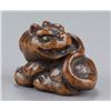 Image 6 : A wood netsuke of a tiger.