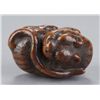 Image 9 : A wood netsuke of a tiger.