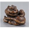 Image 1 : A wood netsuke of a tiger and cub.