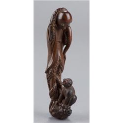 A boxwood netsuke of an octopus and monkey.