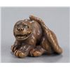 Image 1 : A wood netsuke of a tigress.