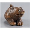 Image 2 : A wood netsuke of a tigress.
