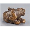 Image 4 : A wood netsuke of a tigress.