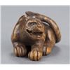 Image 5 : A wood netsuke of a tigress.