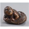 Image 1 : A wood netsuke of a ningyo.