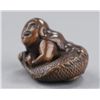 Image 2 : A wood netsuke of a ningyo.