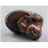 Image 8 : A wood netsuke of a ningyo.