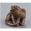 Image 4 : A wood netsuke of a tiger.