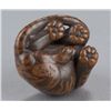 Image 7 : A wood netsuke of a tiger.
