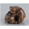 Image 1 : A wood netsuke of two puppies.