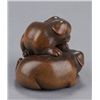 Image 4 : A wood netsuke of two puppies.