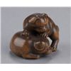 Image 5 : A wood netsuke of two puppies.