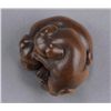 Image 6 : A wood netsuke of two puppies.