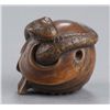 Image 1 : A wood netsuke of a snake and skull.