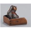 Image 4 : A wood netsuke of a puppy.