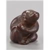 Image 1 : A wood netsuke of a monkey.