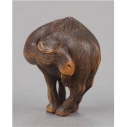A wood netsuke of a dromedary camel, after Hokusai