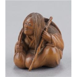 A boxwood netsuke of Ono no Komachi.