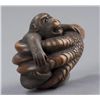 Image 2 : A wood netsuke of a monkey held in Eagle's Claw.