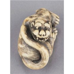 An ivory netsuke of a tiger.
