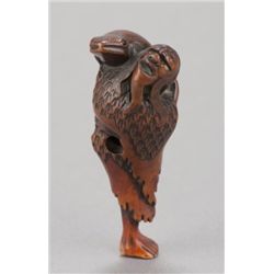 A wood netsuke of a Gama Sennin.
