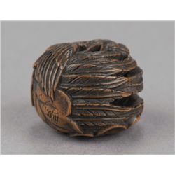A wood ryusa manju of a phoenix.