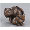 Image 1 : A wood netsuke of a tigress and cub.