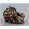 Image 5 : A wood netsuke of a tigress and cub.
