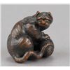Image 1 : A wood netsuke of a tiger on bamboo.