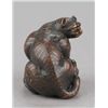 Image 4 : A wood netsuke of a tiger on bamboo.
