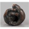 Image 5 : A wood netsuke of a tiger on bamboo.
