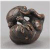 Image 6 : A wood netsuke of a tiger on bamboo.