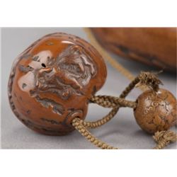 A kumari netsuke of three puppies.