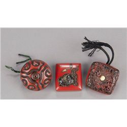 A group of three lacquer manju.
