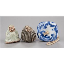Group of three netsuke, various materials.