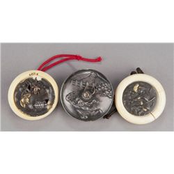 A group of three metal netsuke.