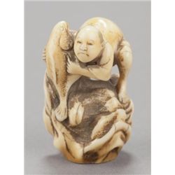 A marine ivory netsuke of a fisherman and fish.