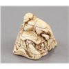 Image 5 : A carved ivory netsuke of an elephant.