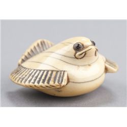 An ivory netsuke of Fukura Suzume.