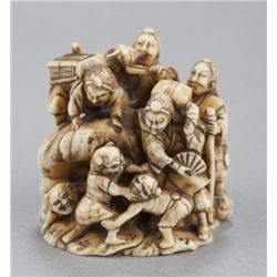 An ivory netsuke of Shutendoji as priests on conch