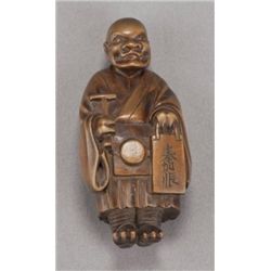 A wood netsuke of Oni Nembutsu.