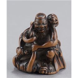 A wood netsuke of Kintoki.