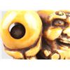 Image 2 : An ivory netsuke of a foreigner carring Tama.